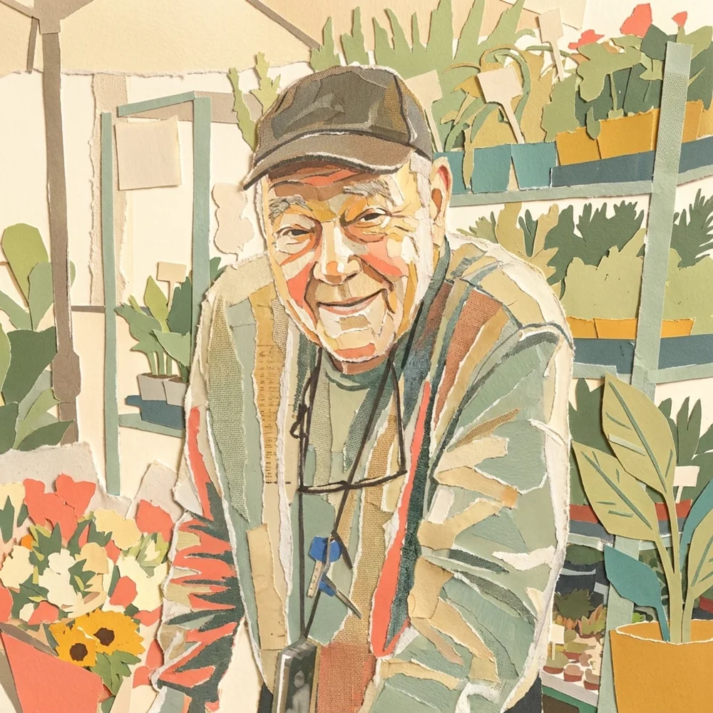 Romi smiling at the camera beside the neighbourhood flower stall